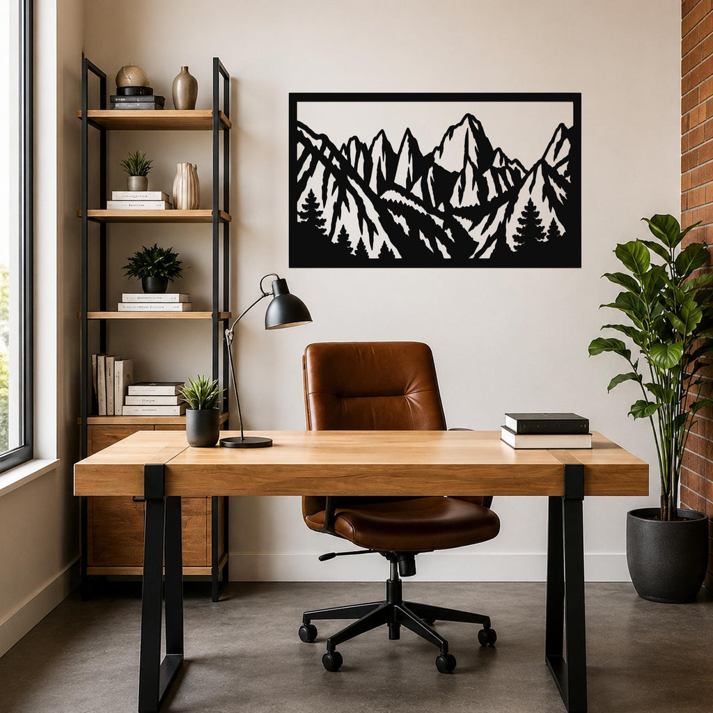 Black metal wall art with a mountain range silhouette, mounted above a wooden desk in a home office.