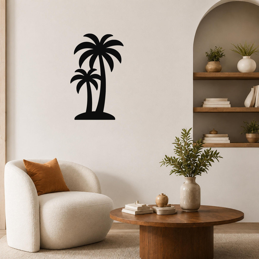 Black metal wall art featuring a silhouette of two palm trees, mounted on a living room wall above a round wooden coffee table.