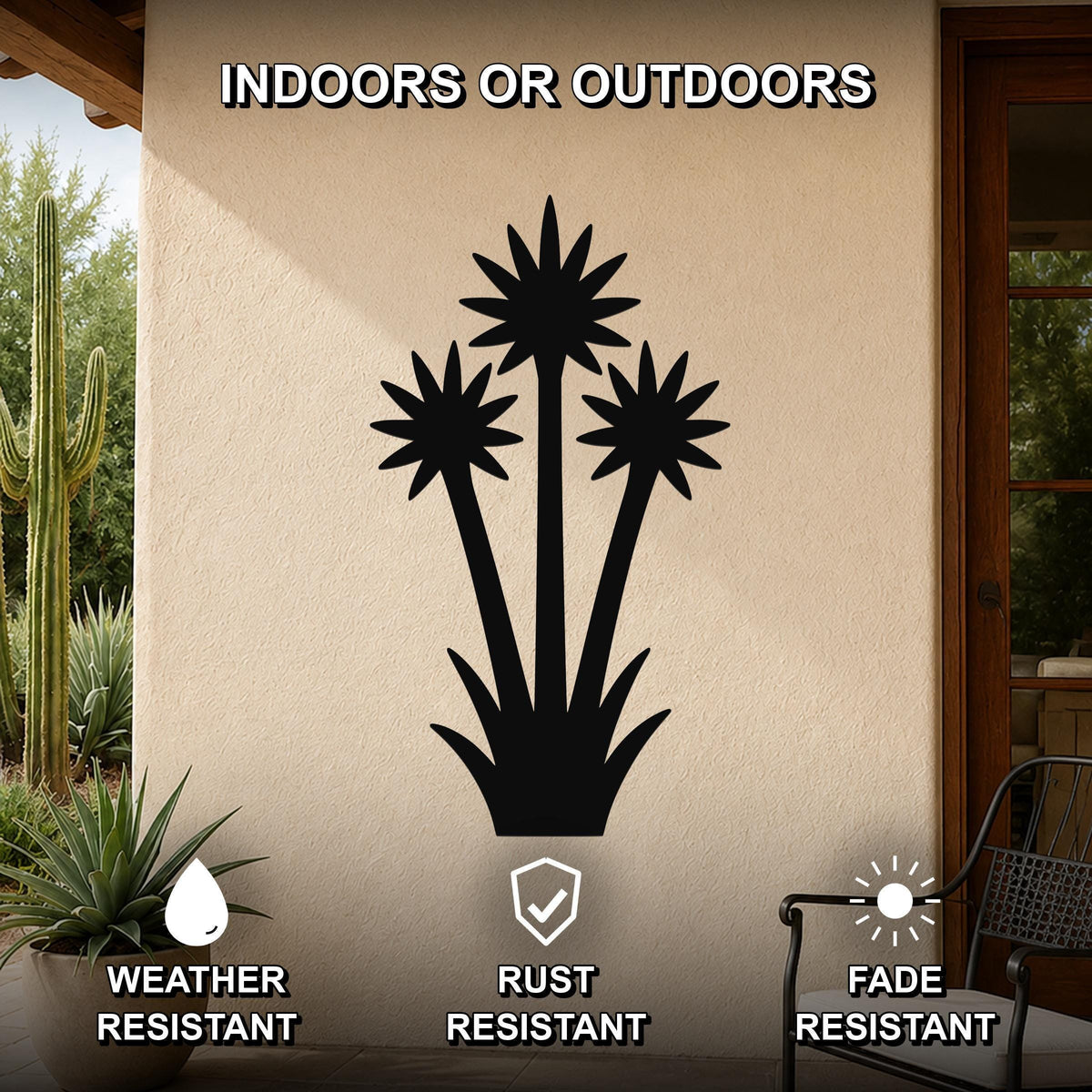 Black metal yucca wall art with three blooming flower cutouts, mounted on an outdoor patio wall, weather, rust, and fade resistant.