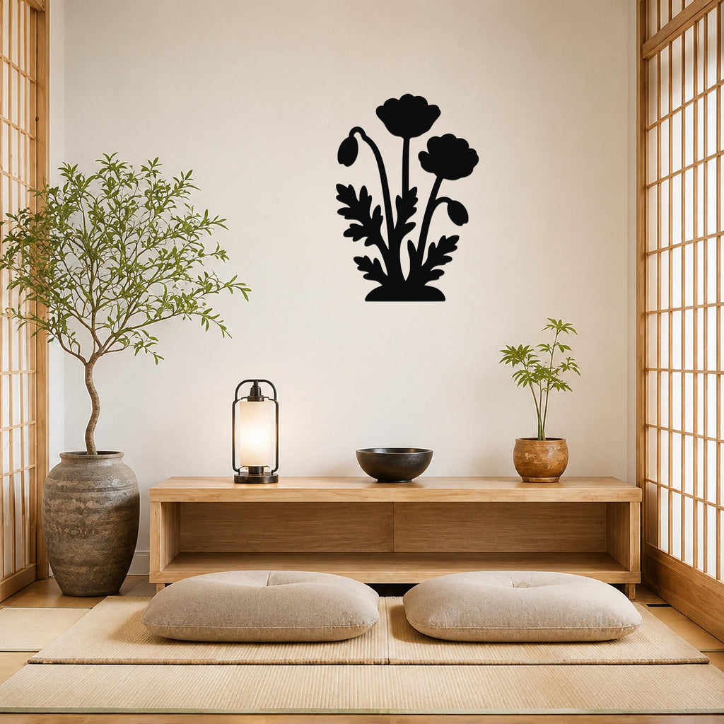 Black metal wall art with a floral silhouette of three blossoms and leaves, mounted on a light-colored wall above a wooden console in a minimalist living room.