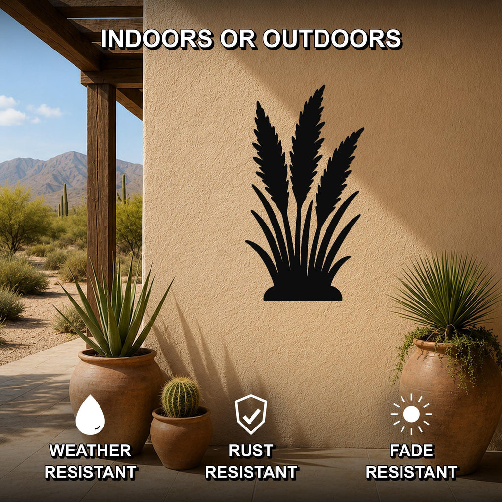 Black metal wall art of a wild grass silhouette, mounted on an outdoor patio wall beside potted plants, weather, rust, and fade resistant.