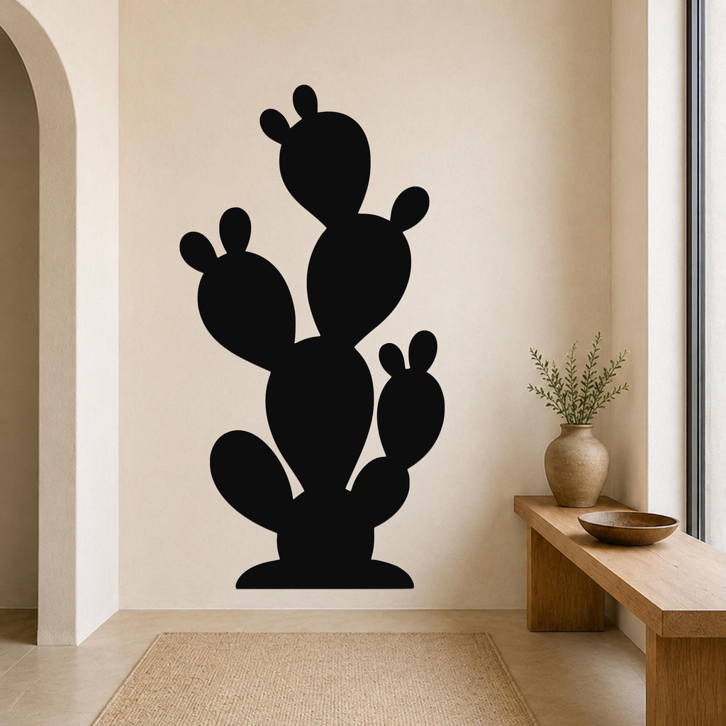 Black metal cactus wall art with multiple paddle-shaped segments, mounted on a beige wall above a wooden bench in a modern entryway.