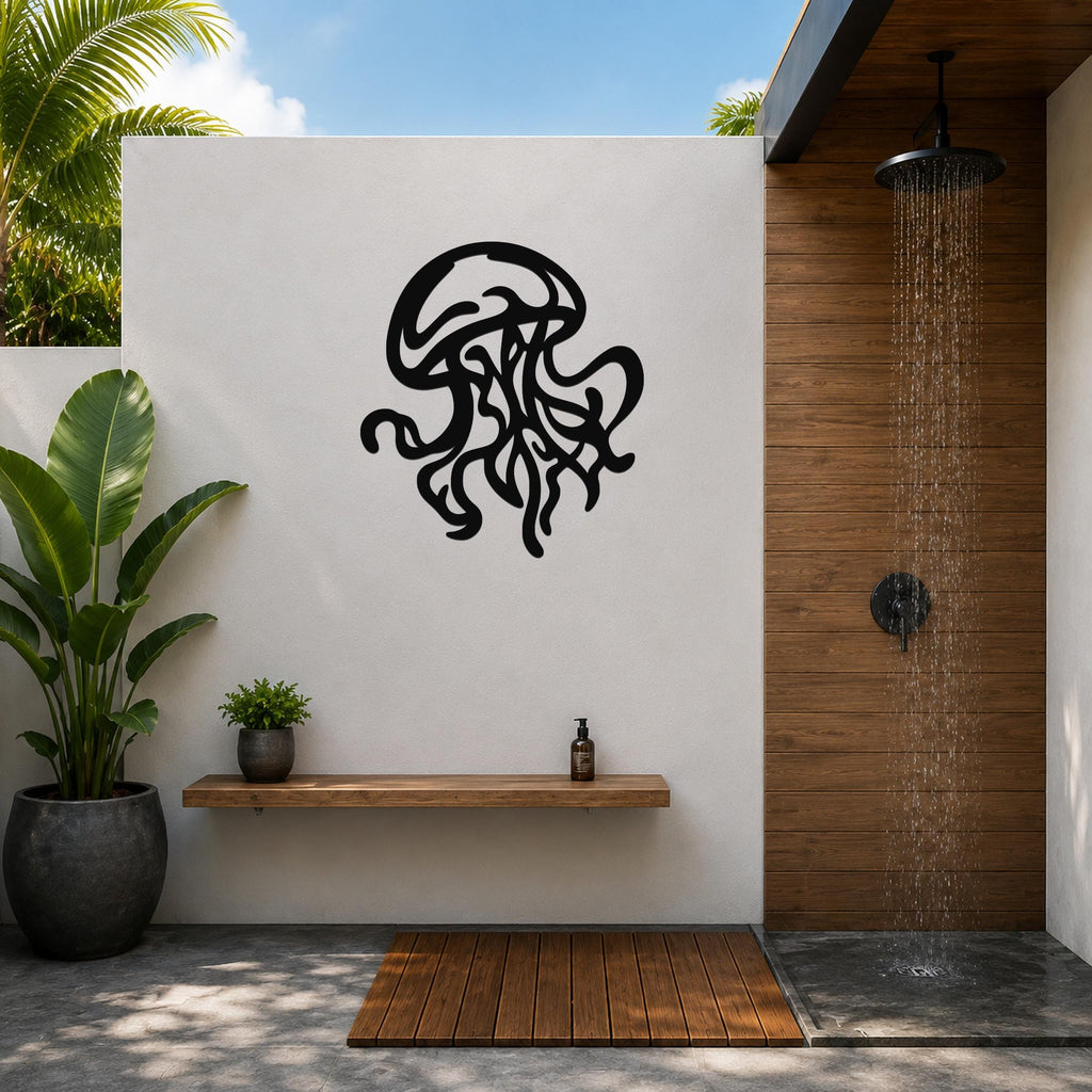 Black metal jellyfish wall art with tentacle cutouts, mounted on a white outdoor wall above a wooden shelf in a modern bathroom.