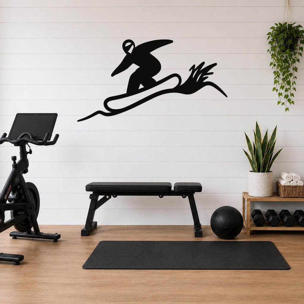 Black metal snowboarder wall sculpture with motion-line cutouts, mounted on a white shiplap wall above a workout bench in a home gym.