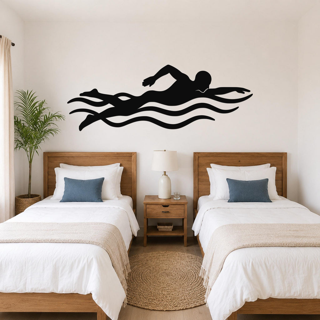 Black metal swimmer wall art with motion-line cutouts, mounted above two beds in a bedroom.
