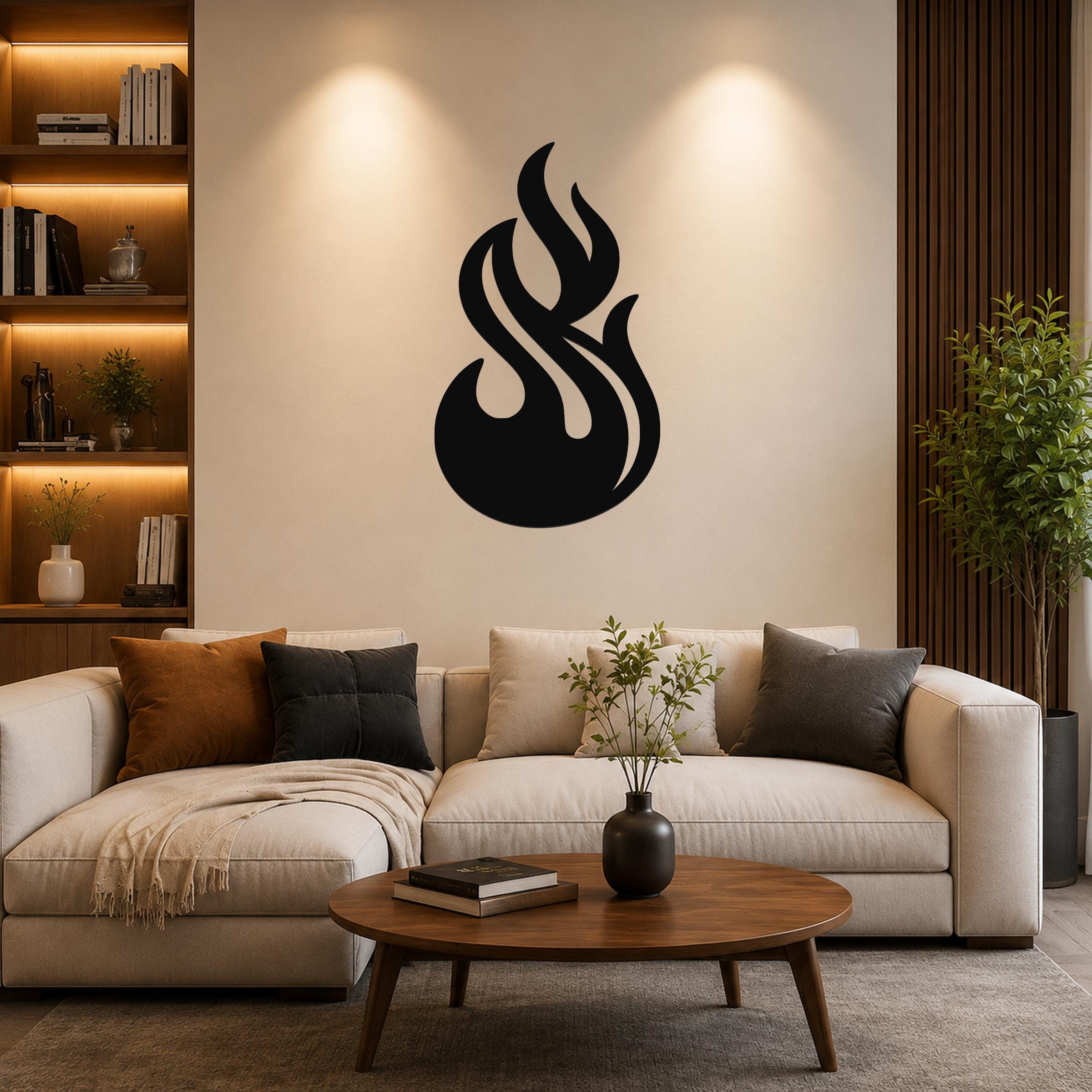 Black metal flame wall art with fluid, swirling cutouts, mounted on a living room wall above a beige sofa.