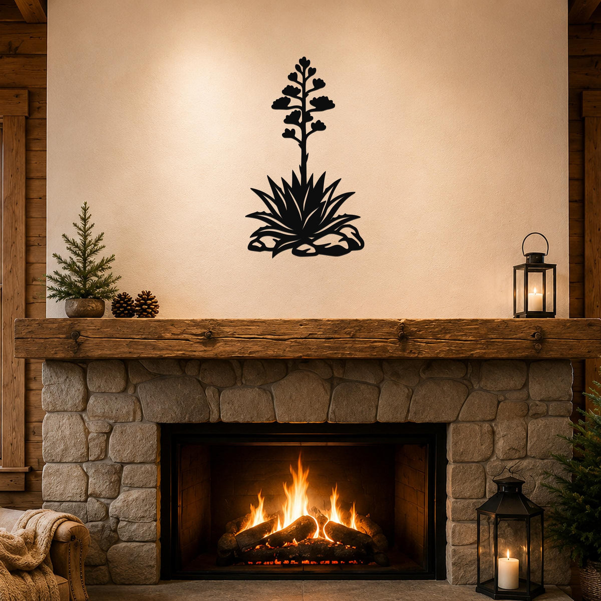 Black metal agave wall art with a blooming flower silhouette, mounted above a stone fireplace in a rustic living room.