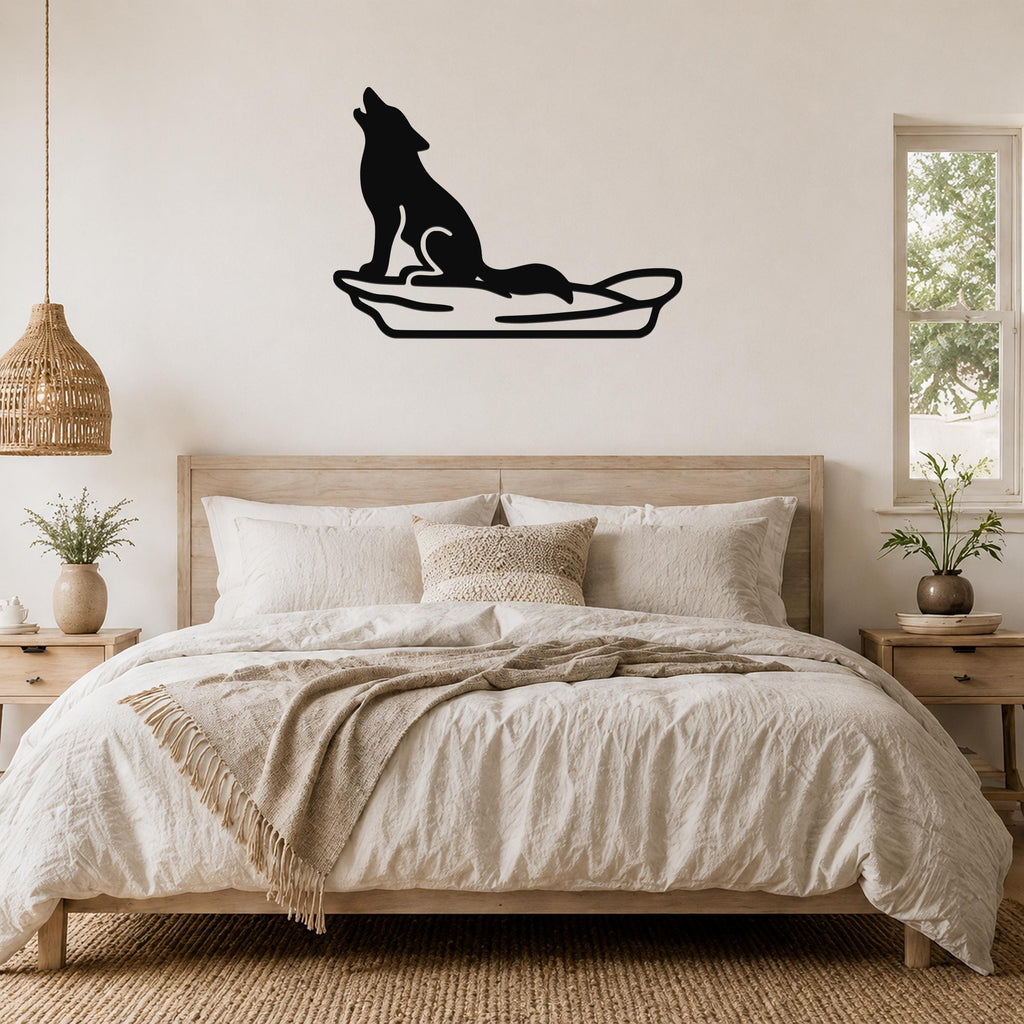 Black metal coyote wall art in a howling silhouette, mounted above a bed in a neutral bedroom.