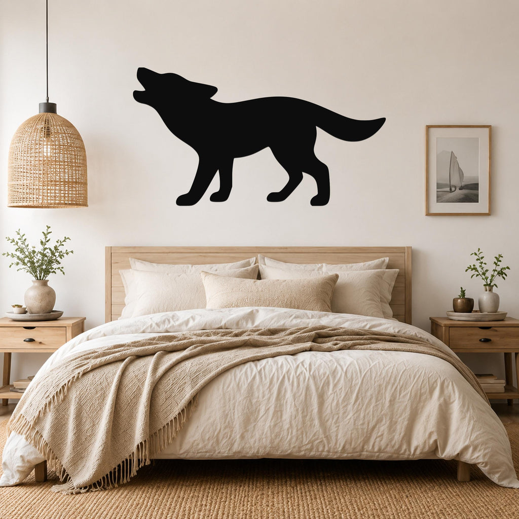 Black metal coyote wall art silhouette howling, mounted above a bed in a neutral bedroom.
