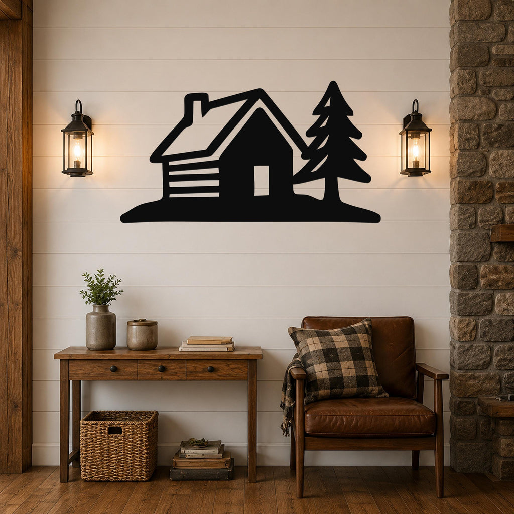 Black metal wall art featuring a cabin and pine tree silhouette, mounted on a shiplap wall above a wooden console table in a living room.