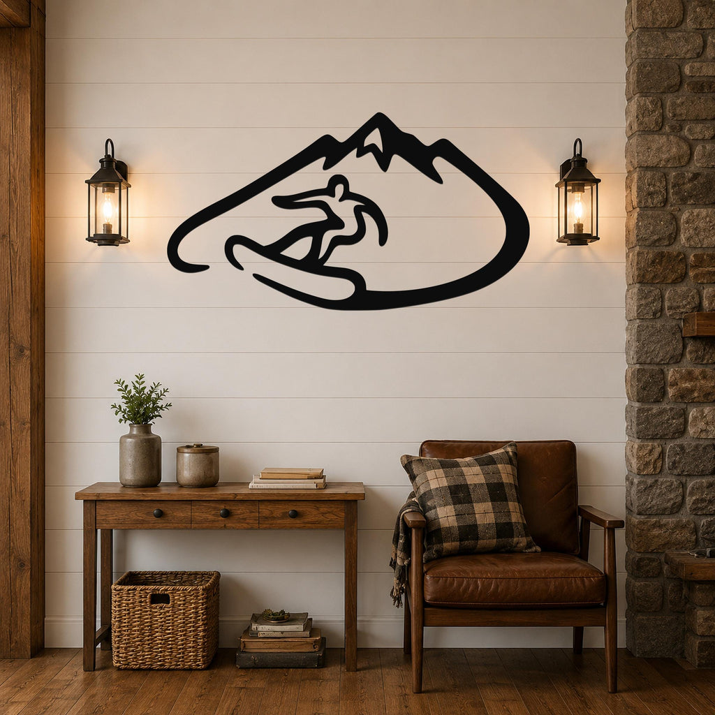 Black metal wall art featuring a minimalist silhouette of a snowboarder in a mountain, mounted on a shiplap wall above a wooden console table in a living room.