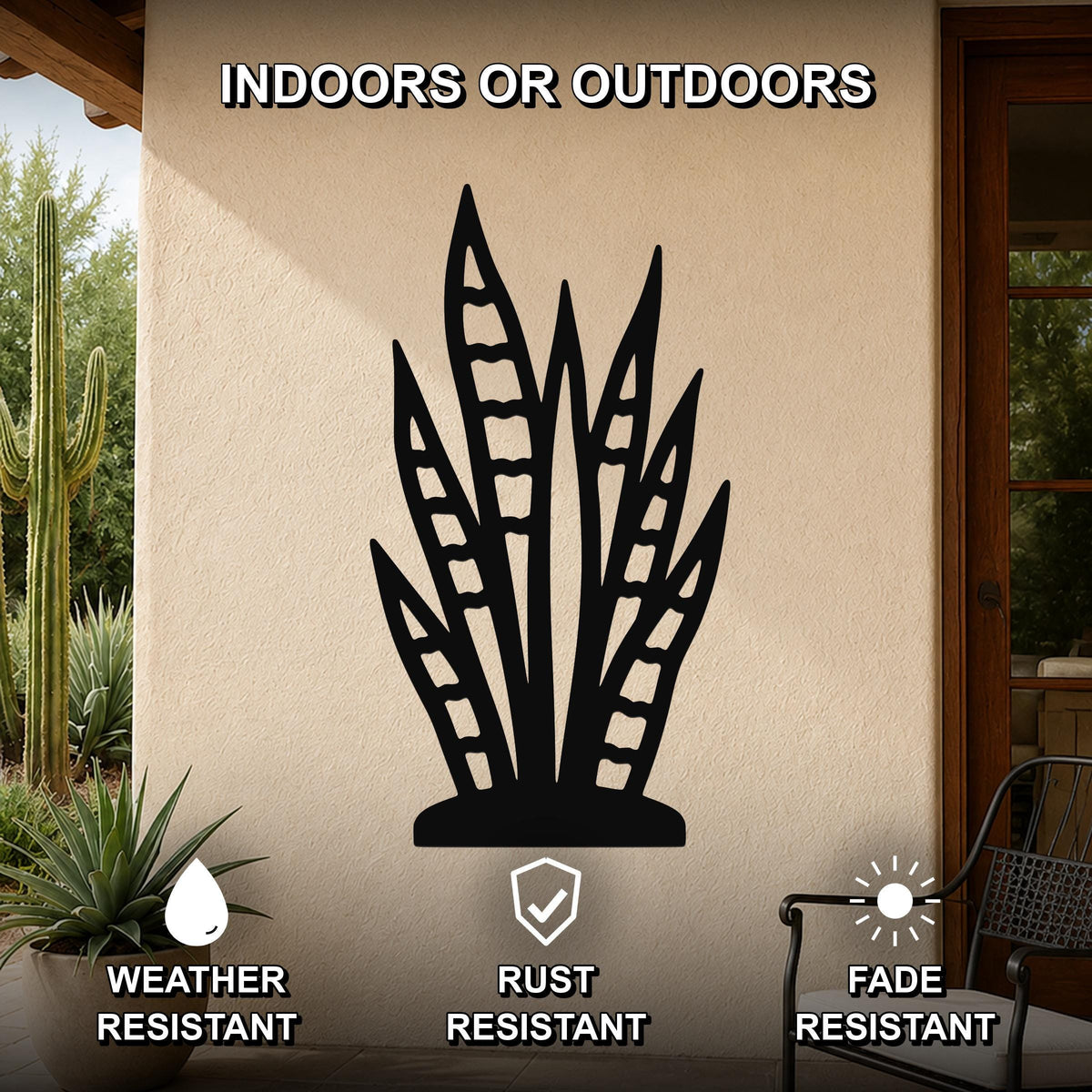 Black metal snake plant wall art with leaf cutouts, mounted on an outdoor patio wall.