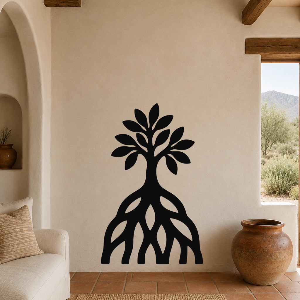 Black metal wall art silhouette of a mangrove tree with visible root system, mounted on a beige wall in a living room with terracotta flooring and wooden beams.