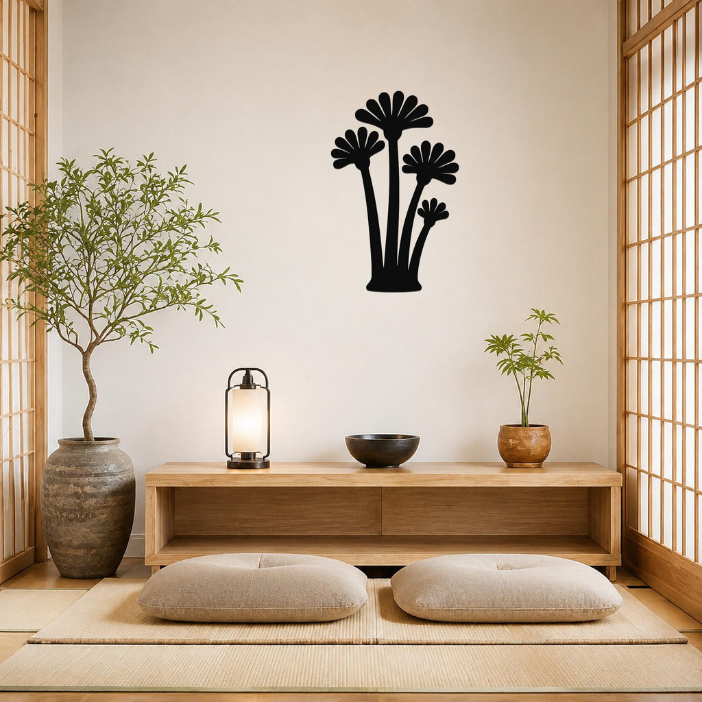 Black metal wall art with a fan palm tree silhouette, mounted on a wall above a wooden console in a minimalist living room.