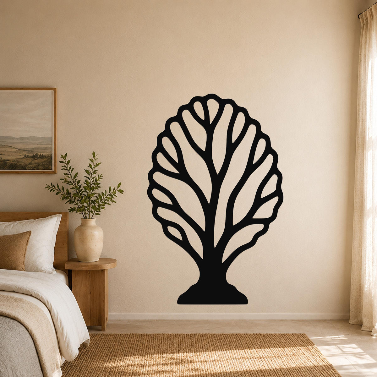 Black metal wall art in a fan coral silhouette with intricate branching cutouts, mounted on a beige bedroom wall above a woven rug.
