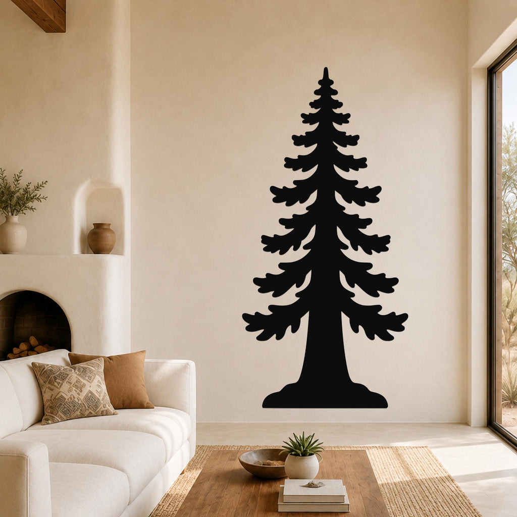 Black metal sequoia tree wall art with layered branch cutouts, mounted on a living room wall above a white sofa.