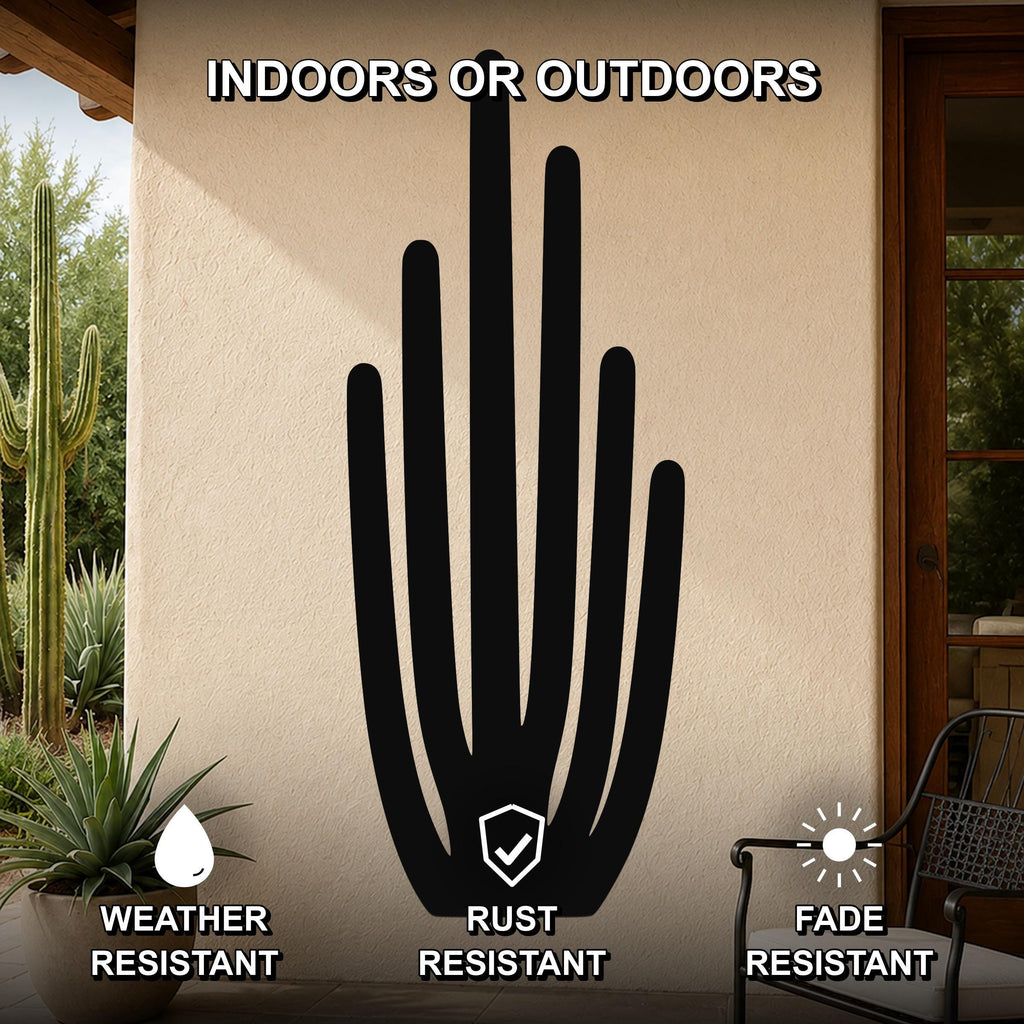 Black metal organ pipe cactus wall art with vertical spine cutouts, mounted on an outdoor patio wall above a potted plant.