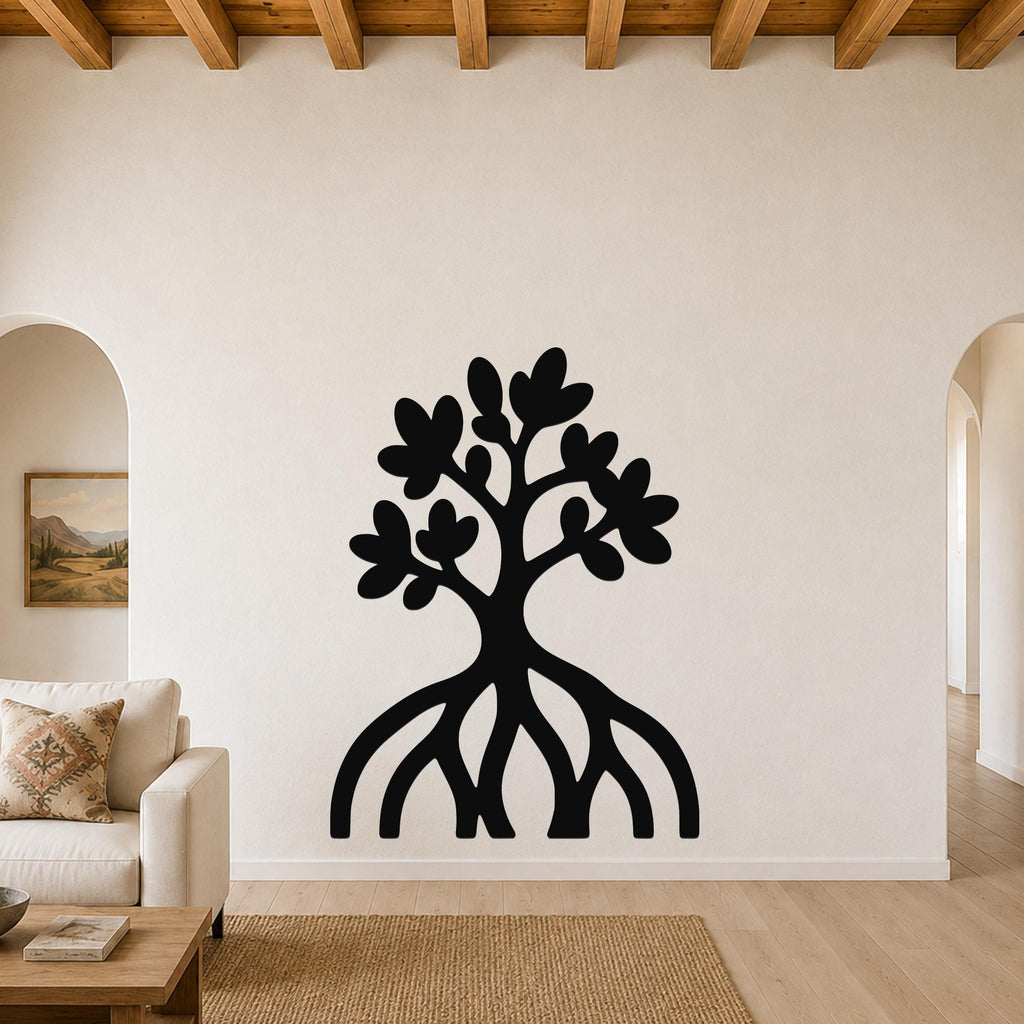 Black metal wall art silhouette of a mangrove tree with visible root system and leafy canopy, mounted on a living room wall above a sofa.