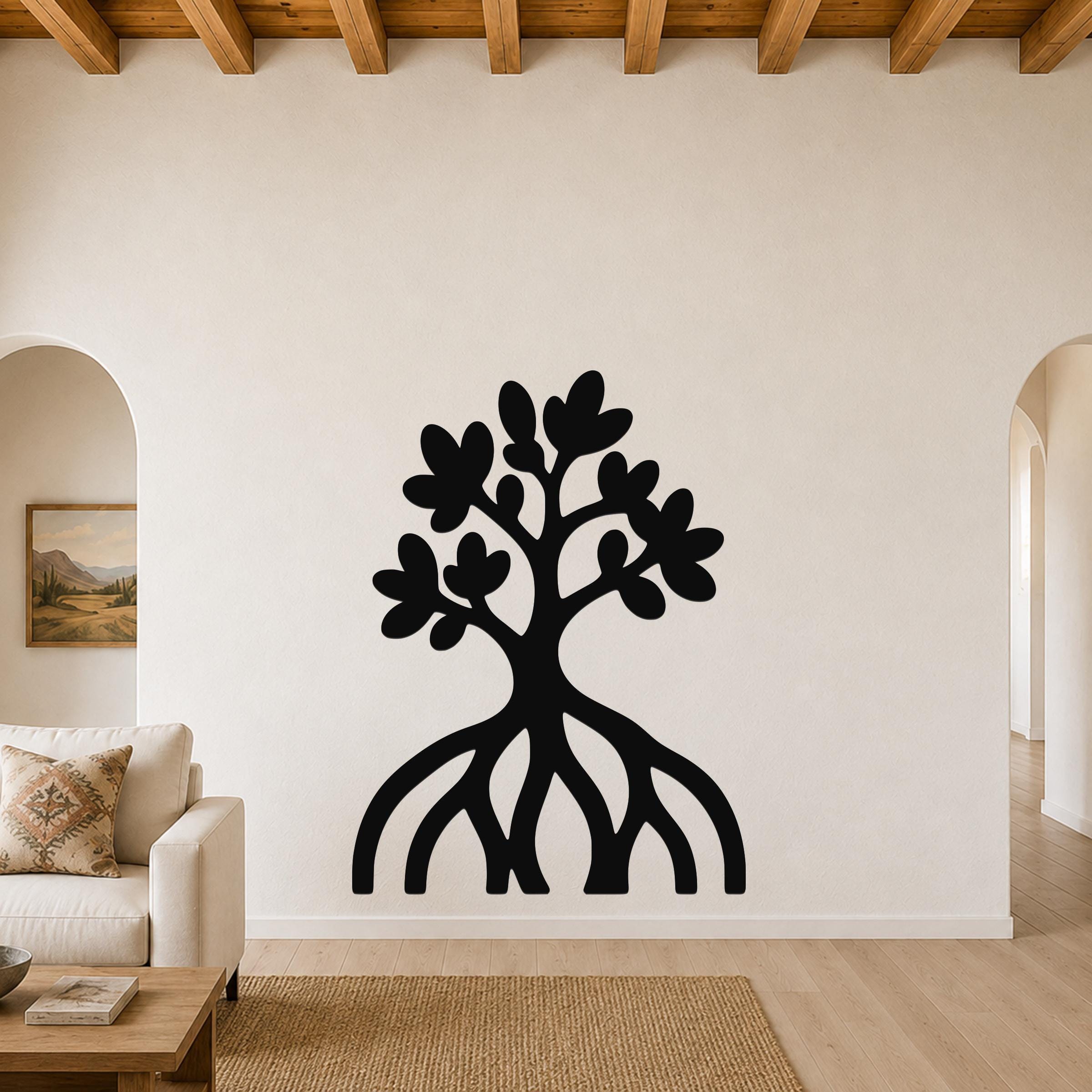 Black metal wall art silhouette of a mangrove tree with visible root system and leafy canopy, mounted on a living room wall above a sofa.