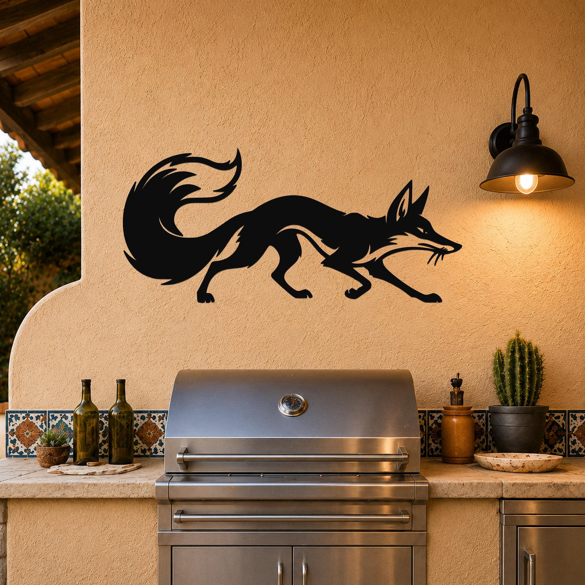 Black metal fox wall art silhouette with motion lines, mounted on a stucco wall above an outdoor grill.