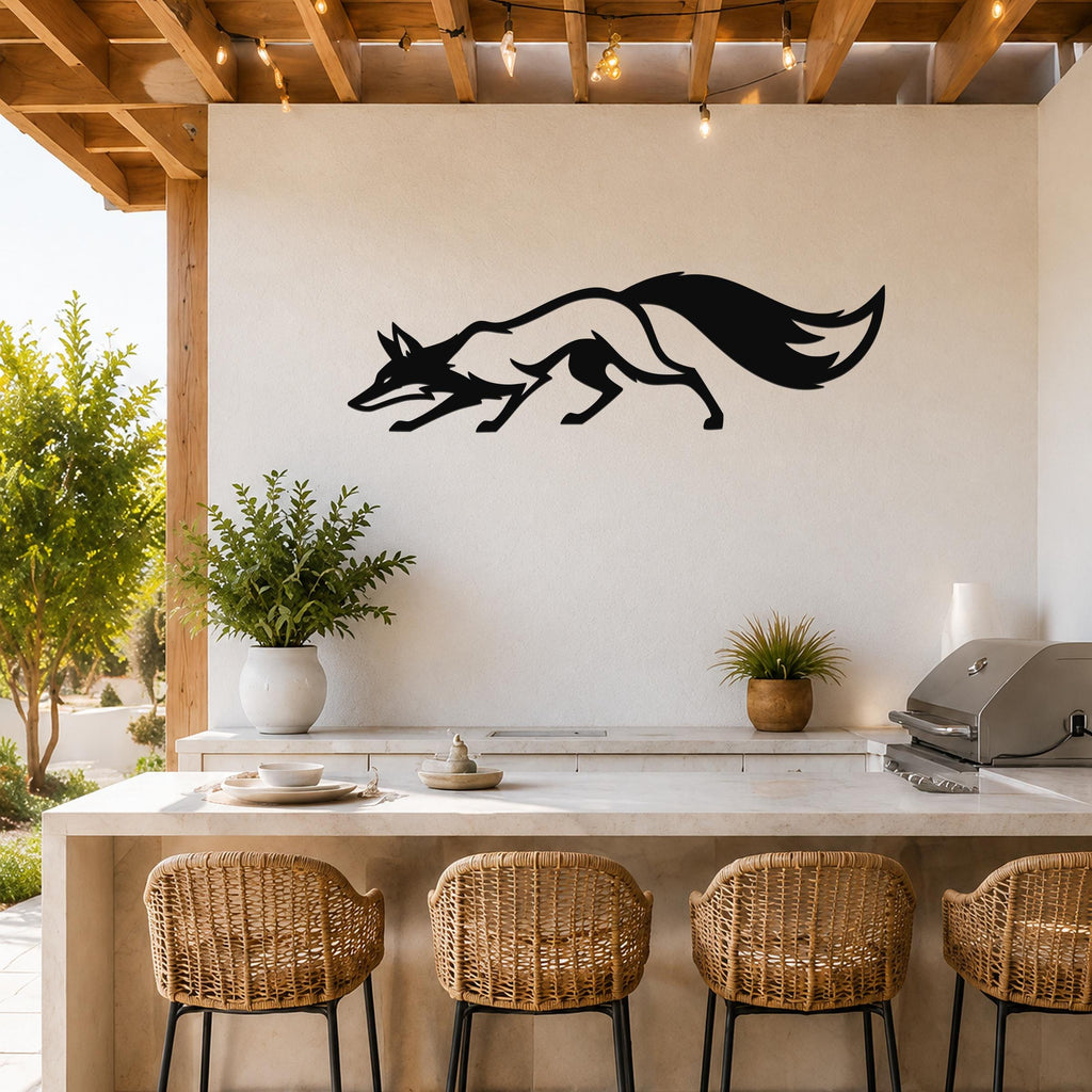 Black metal fox silhouette wall art with motion-line cutouts, mounted above a kitchen counter on a light-colored outdoor patio wall.