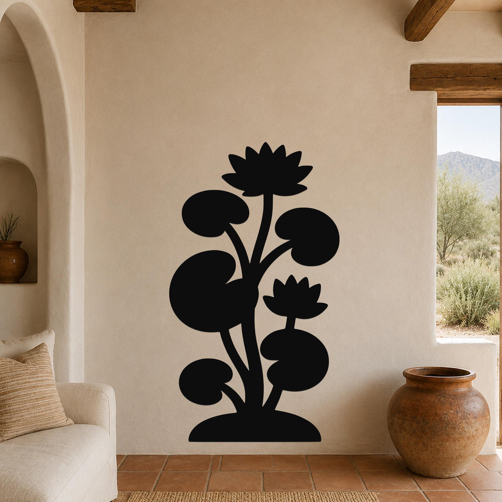 Black metal wall art silhouette of a lotus water lily plant with two flowers and round leaves, mounted on a beige wall in a living room with terracotta flooring.