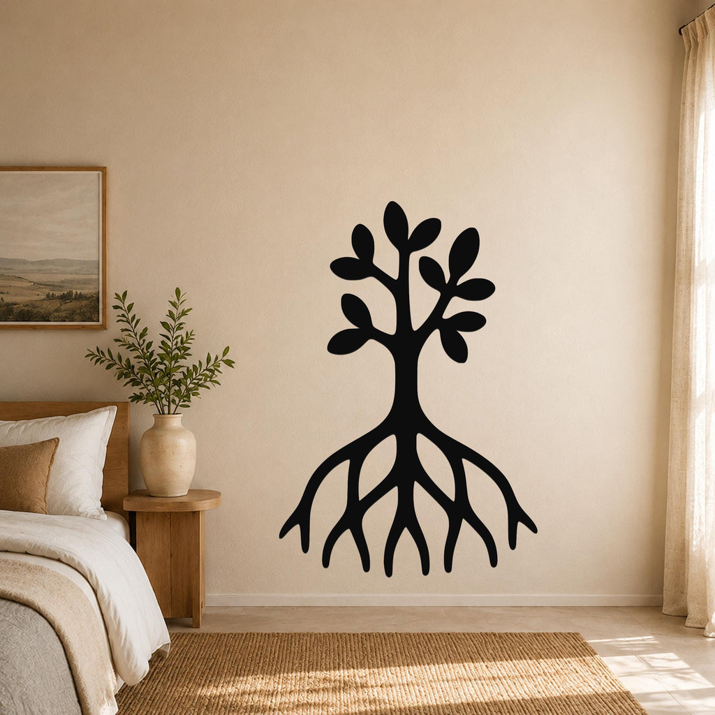 Black metal wall art in the shape of a tree with visible roots and leafy branches, mounted on a beige bedroom wall above a woven rug.