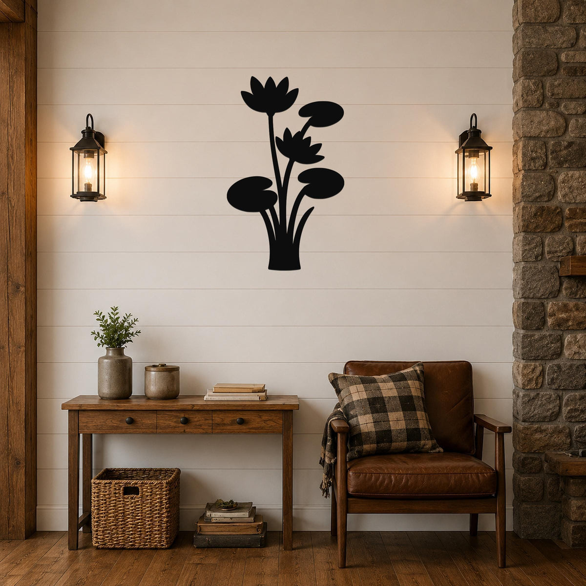 Black metal lotus water lily wall art with layered flower and leaf cutouts, mounted on a shiplap wall above a wooden console table in a living room.