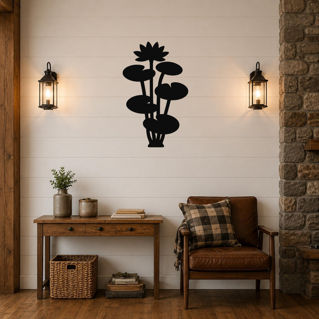 Black metal lotus water lily wall art with layered flower and leaf cutouts, mounted on a shiplap wall above a wooden console table in a living room.