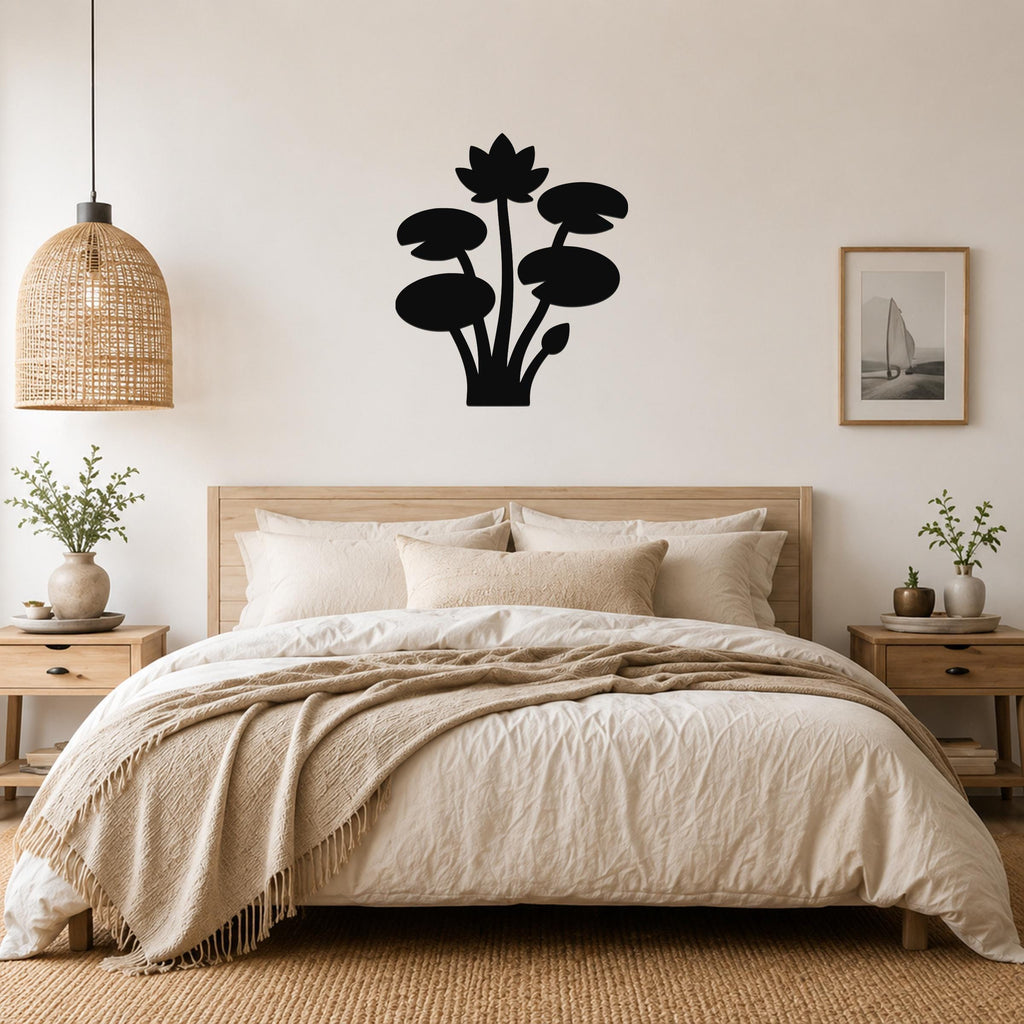 Black metal lotus and water lily wall art silhouette mounted above a wooden bed in a neutral bedroom.