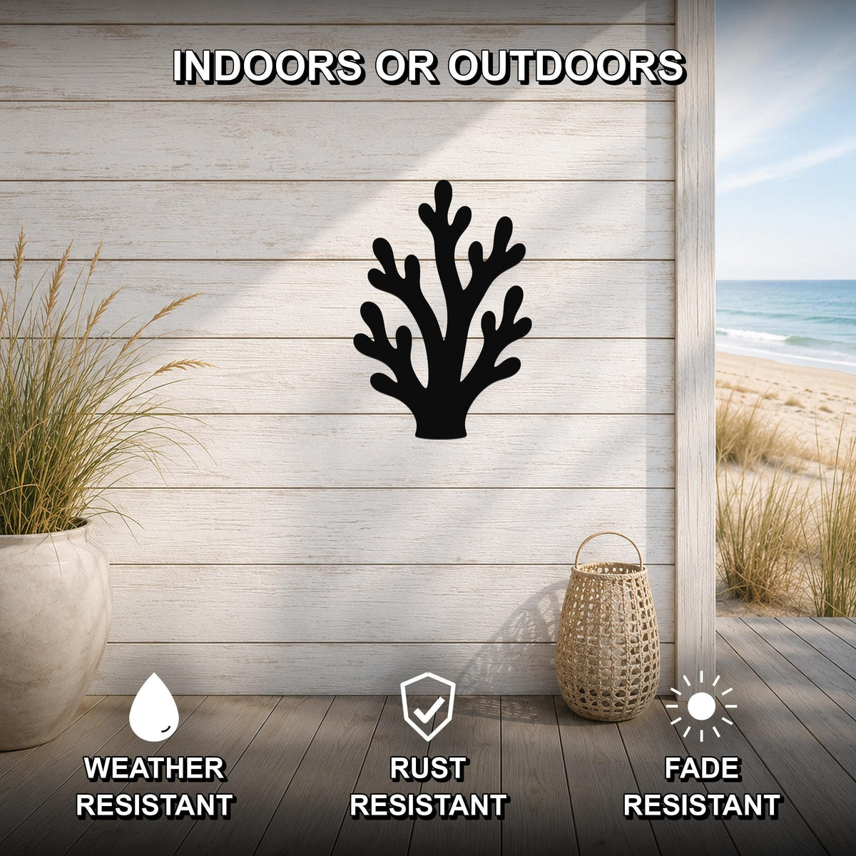 Black metal branching coral wall art silhouette mounted on a light wood plank wall, displayed on a patio with a beach view, weather resistant, rust resistant, and fade resistant.