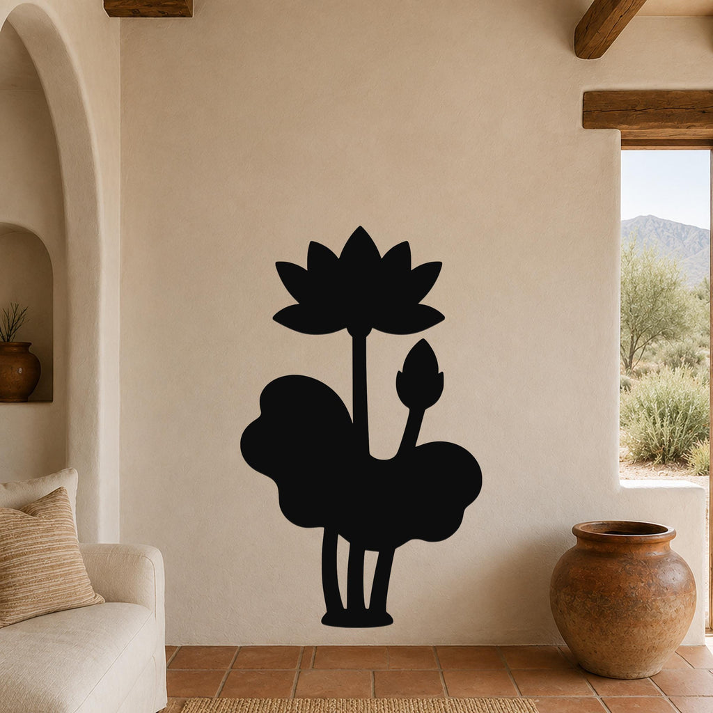 Black metal wall art silhouette of a lotus flower and leaves, mounted on a beige living room wall above a sofa.