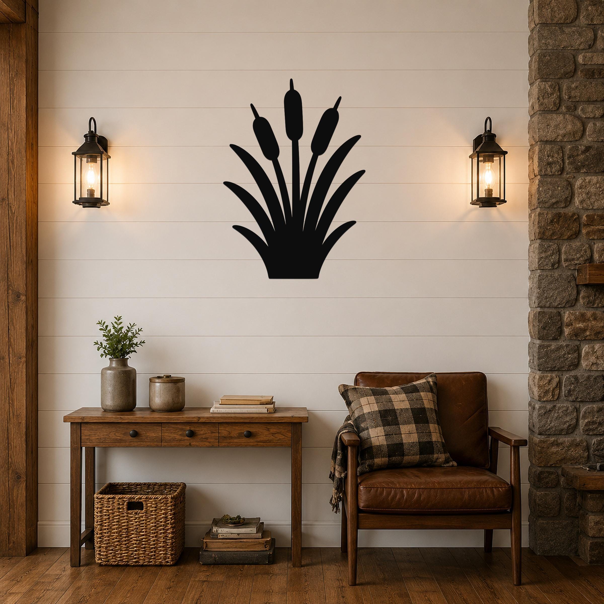 Black metal cattail wall art silhouette mounted on a shiplap wall above a wooden console table in a living room.