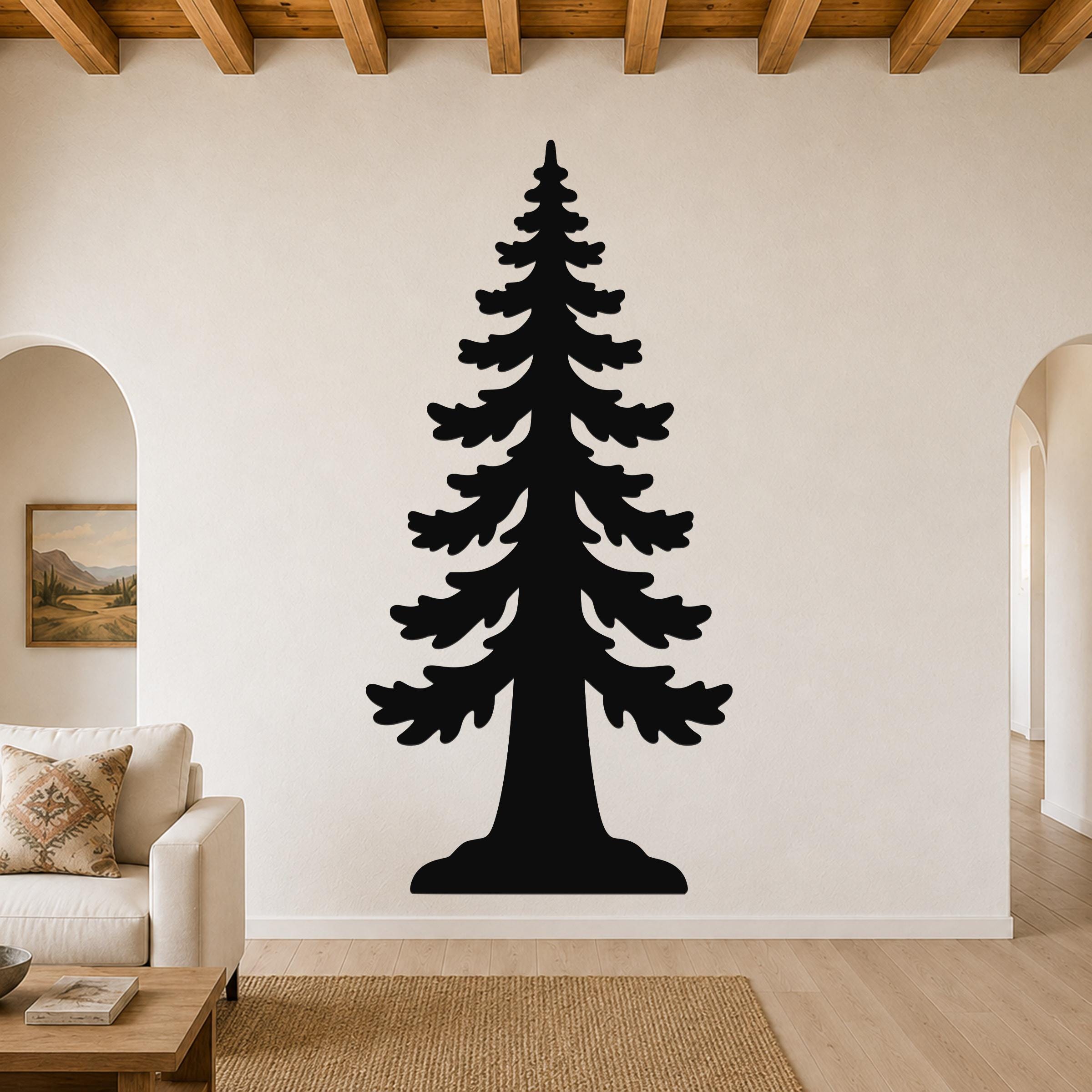 Black metal wall art of a sequoia tree silhouette, mounted on a living room wall above a sofa.