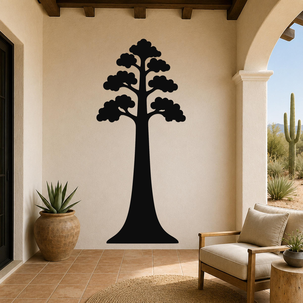 Black metal wall art of a sequoia tree silhouette with layered branches, mounted on a beige stucco wall in a patio setting.