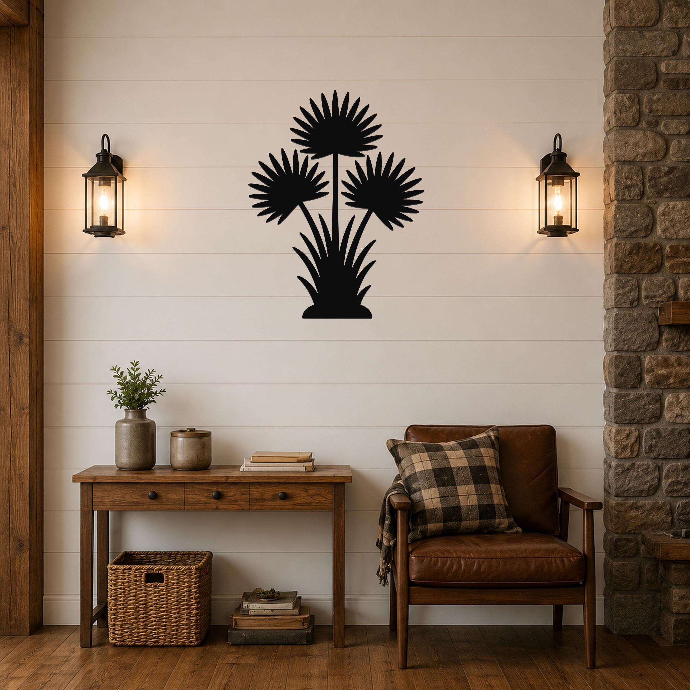 Black metal wall art silhouette of a fan palm tree with three fronds and a base of grass-like leaves, mounted on a shiplap wall above a wooden console table in a living room.