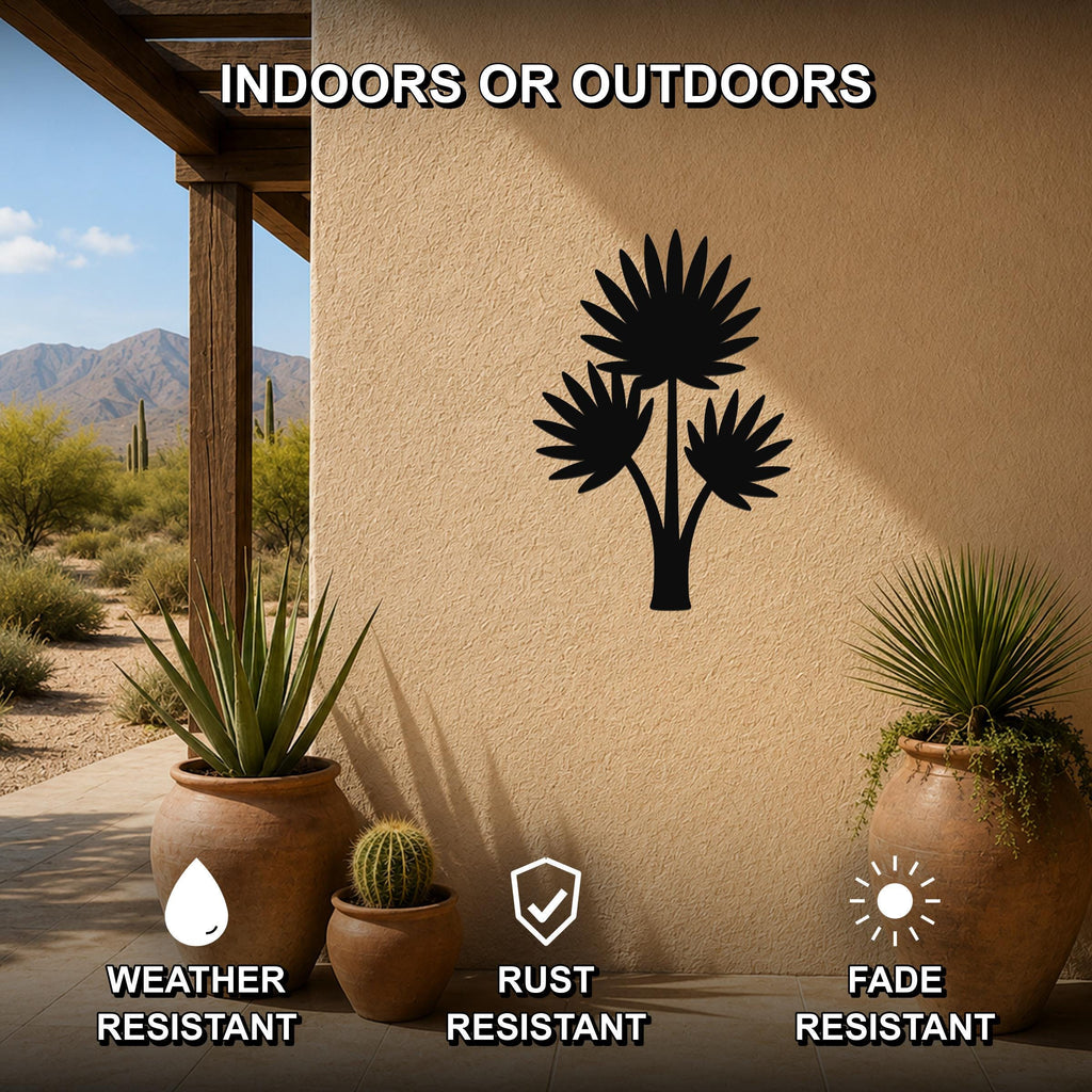 Black metal fan palm tree wall art silhouette mounted on an outdoor patio wall, weather resistant, rust resistant, and fade resistant, with potted plants nearby.