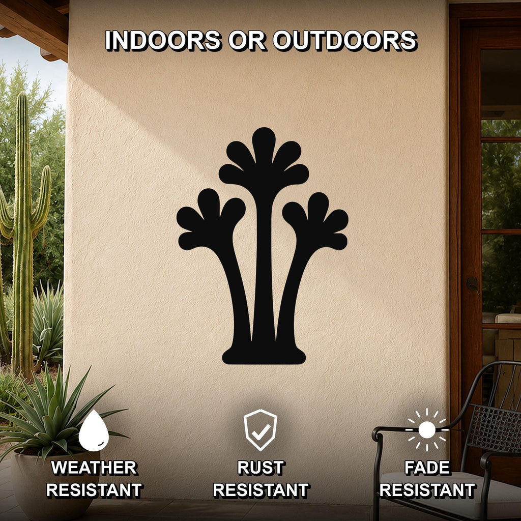 Black metal palm tree wall art with three fronded silhouettes, mounted on an outdoor patio wall above a potted succulent.