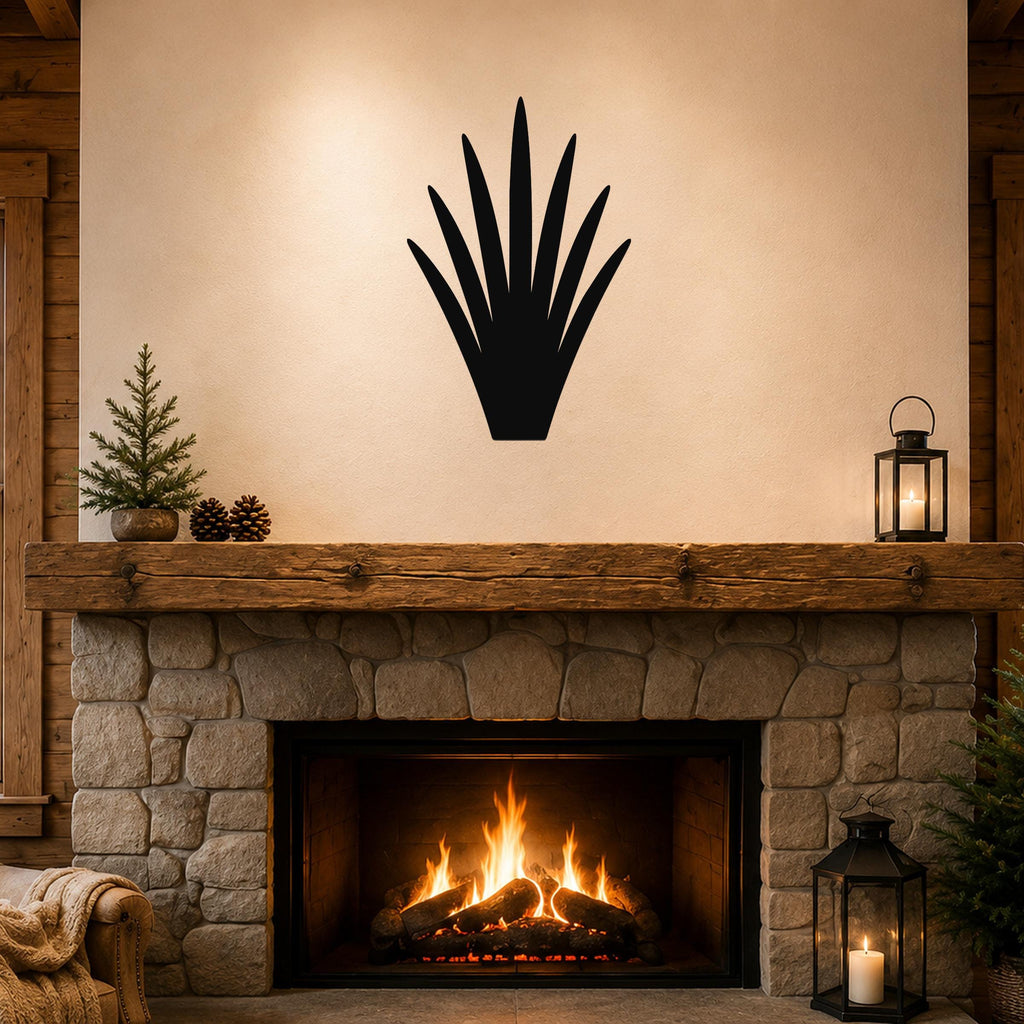 Black metal yucca wall art silhouette mounted above a stone fireplace in a rustic living room.
