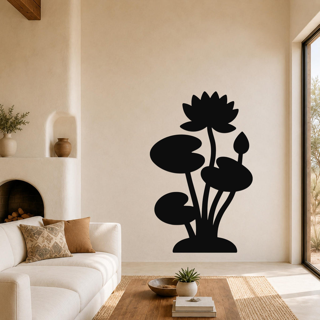 Black metal lotus water lily wall art with silhouette cutouts of flowers and leaves, mounted on a living room wall above a sofa.