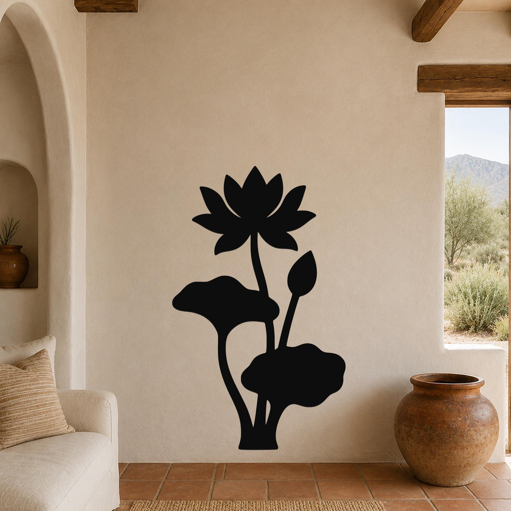 Black metal lotus wall art with a silhouette of a blooming flower and leaves, mounted on a beige wall in a living room with terracotta flooring and wooden beams.
