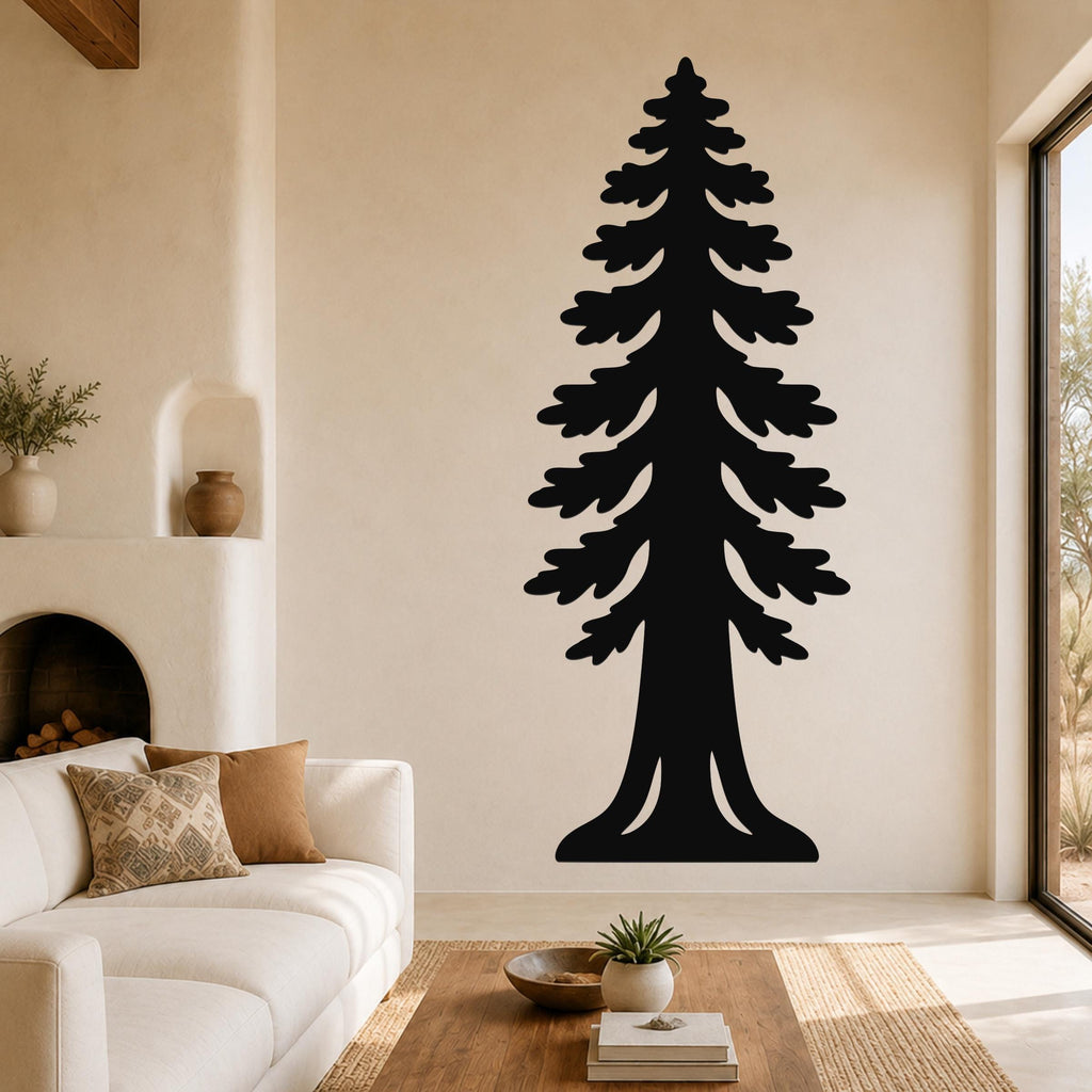 Black metal sequoia tree wall art with layered branch cutouts, mounted on a living room wall above a white sofa.