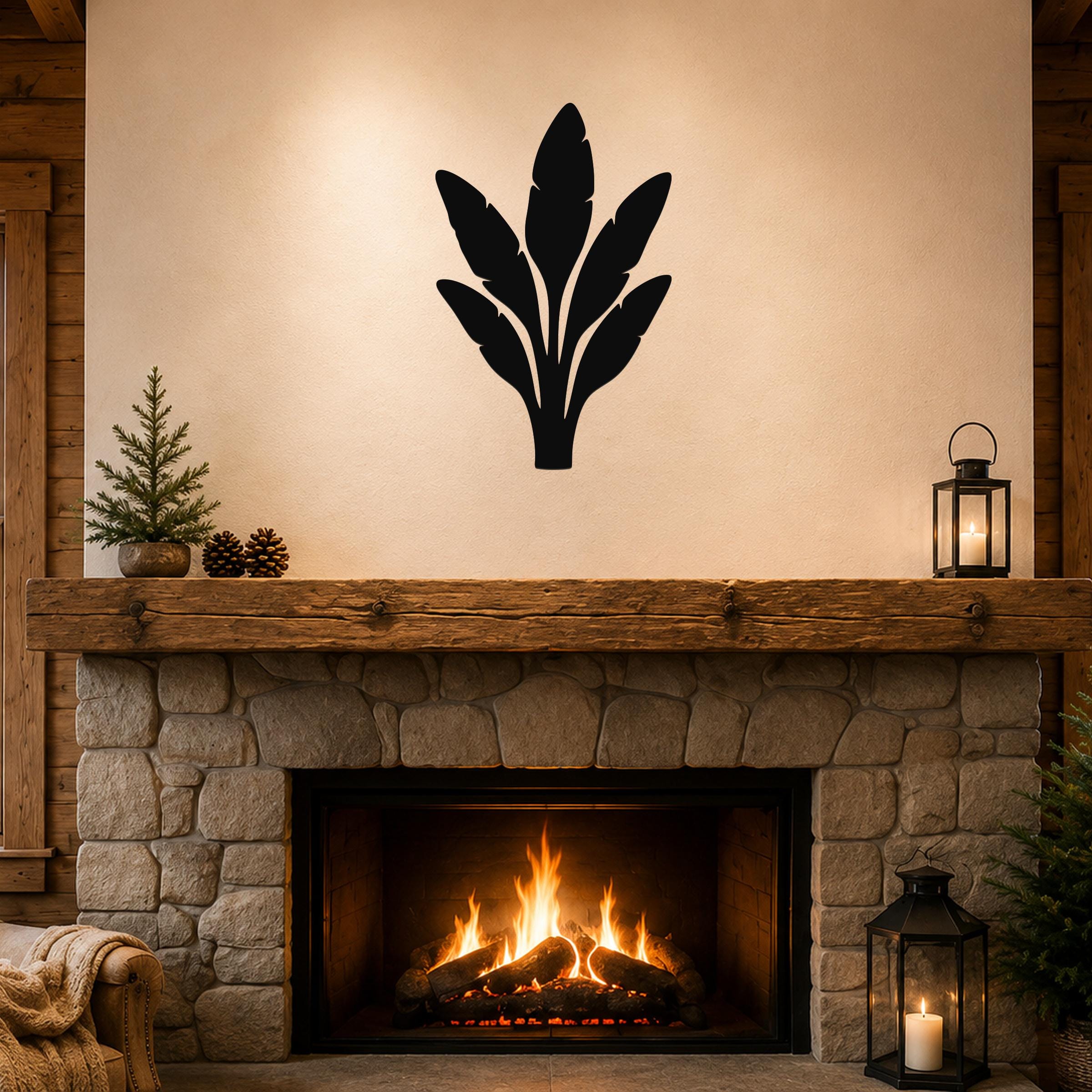 Black metal banana plant wall art with leaf cutouts, mounted above a stone fireplace in a rustic living room.