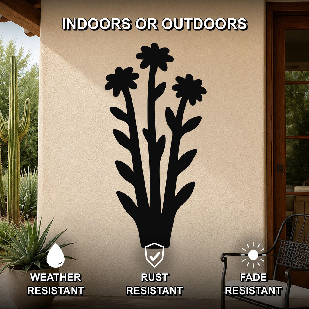 Black metal wildflower wall art with three flower cutouts and leafy stems, mounted on an outdoor patio wall, weather, rust, and fade resistant.