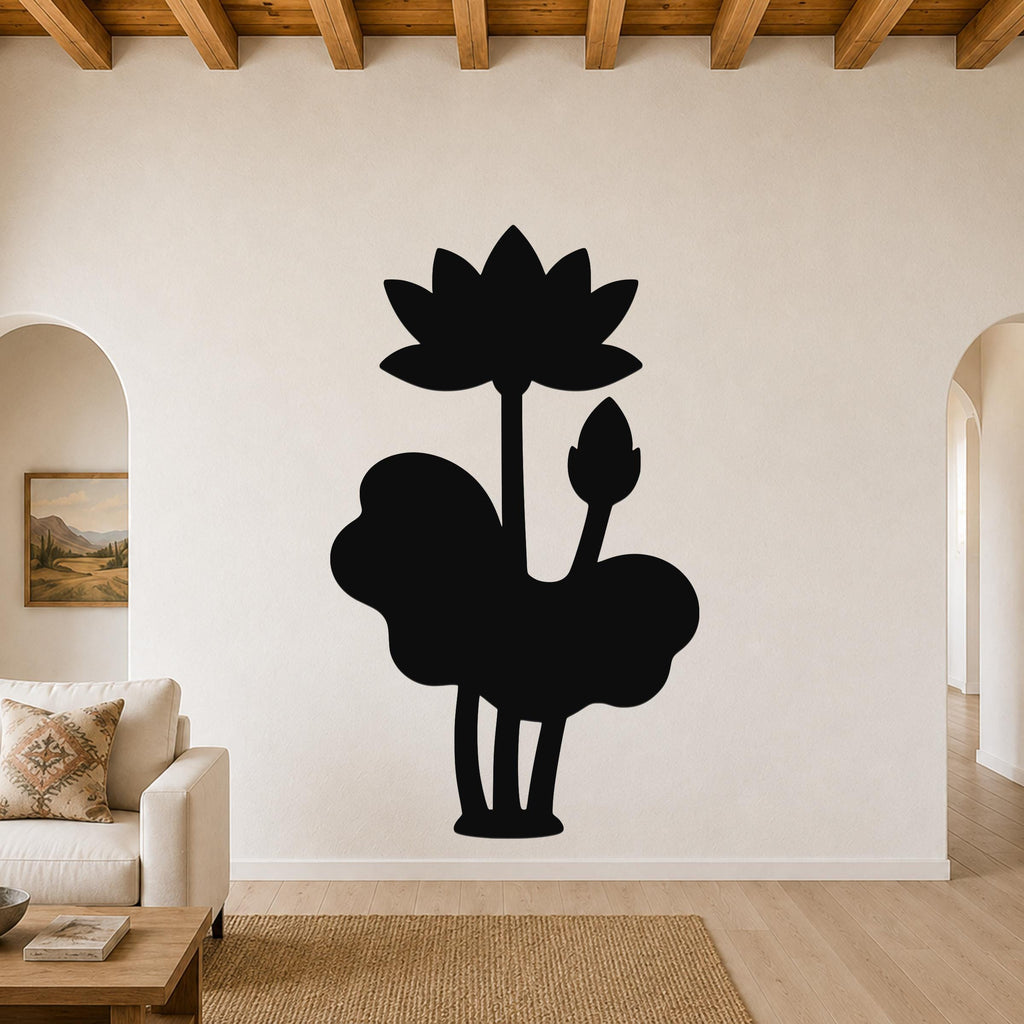 Black metal wall art silhouette of a lotus flower and leaves, mounted on a living room wall above a sofa.