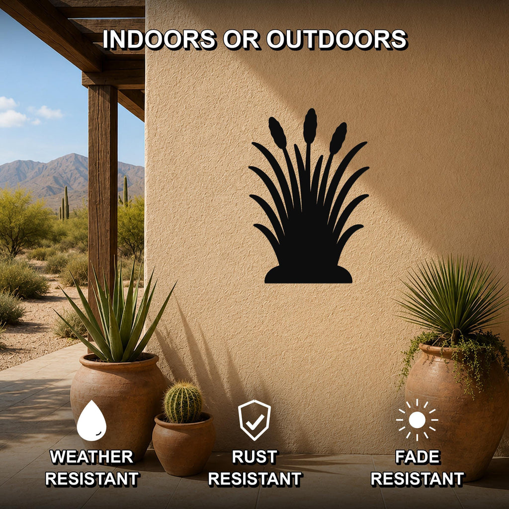 Black metal wall art of a wild grass silhouette, mounted on an outdoor patio wall above potted plants, weather resistant, rust resistant, and fade resistant.