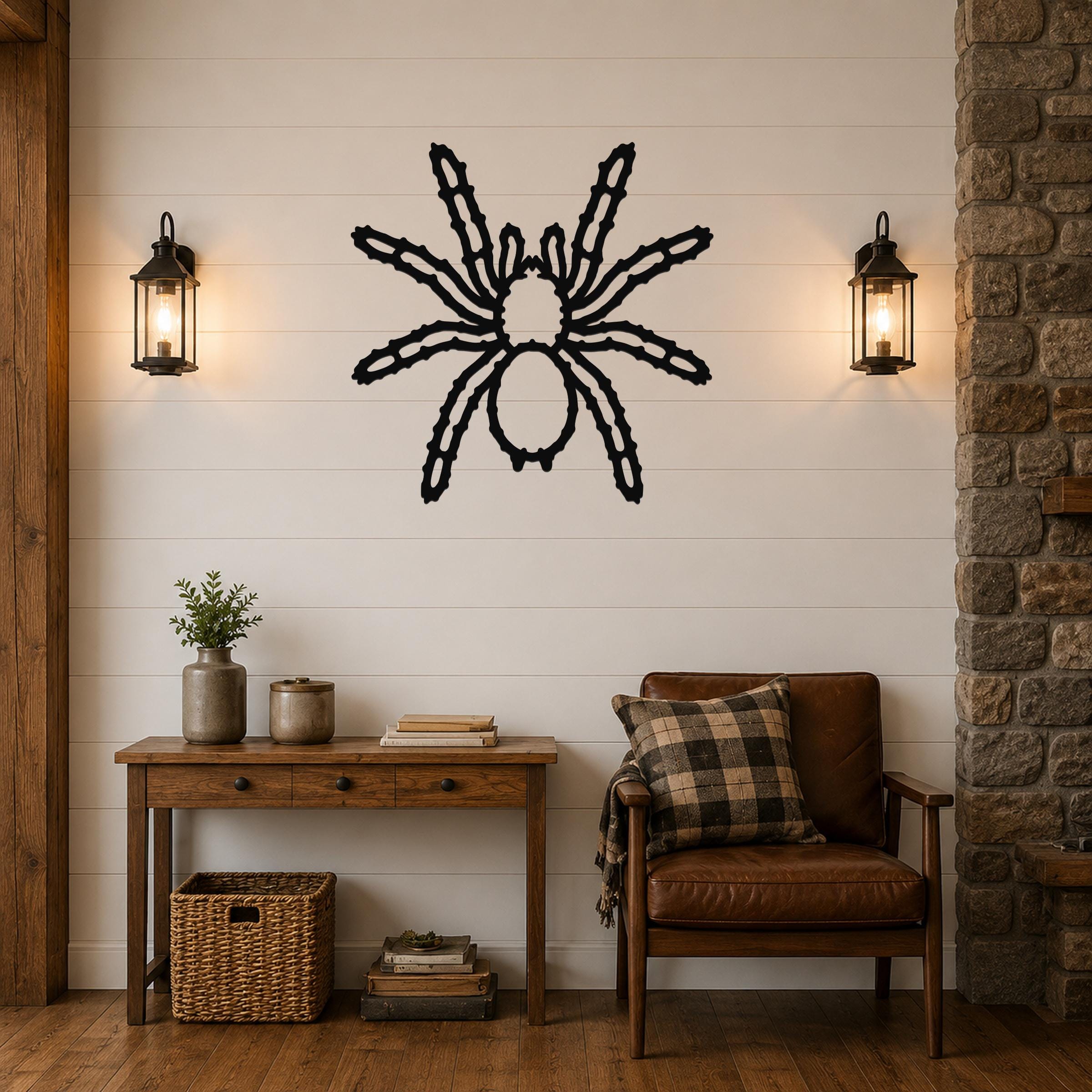 Black metal spider wall art with detailed leg cutouts, mounted on a shiplap wall above a wooden console table in a living room.